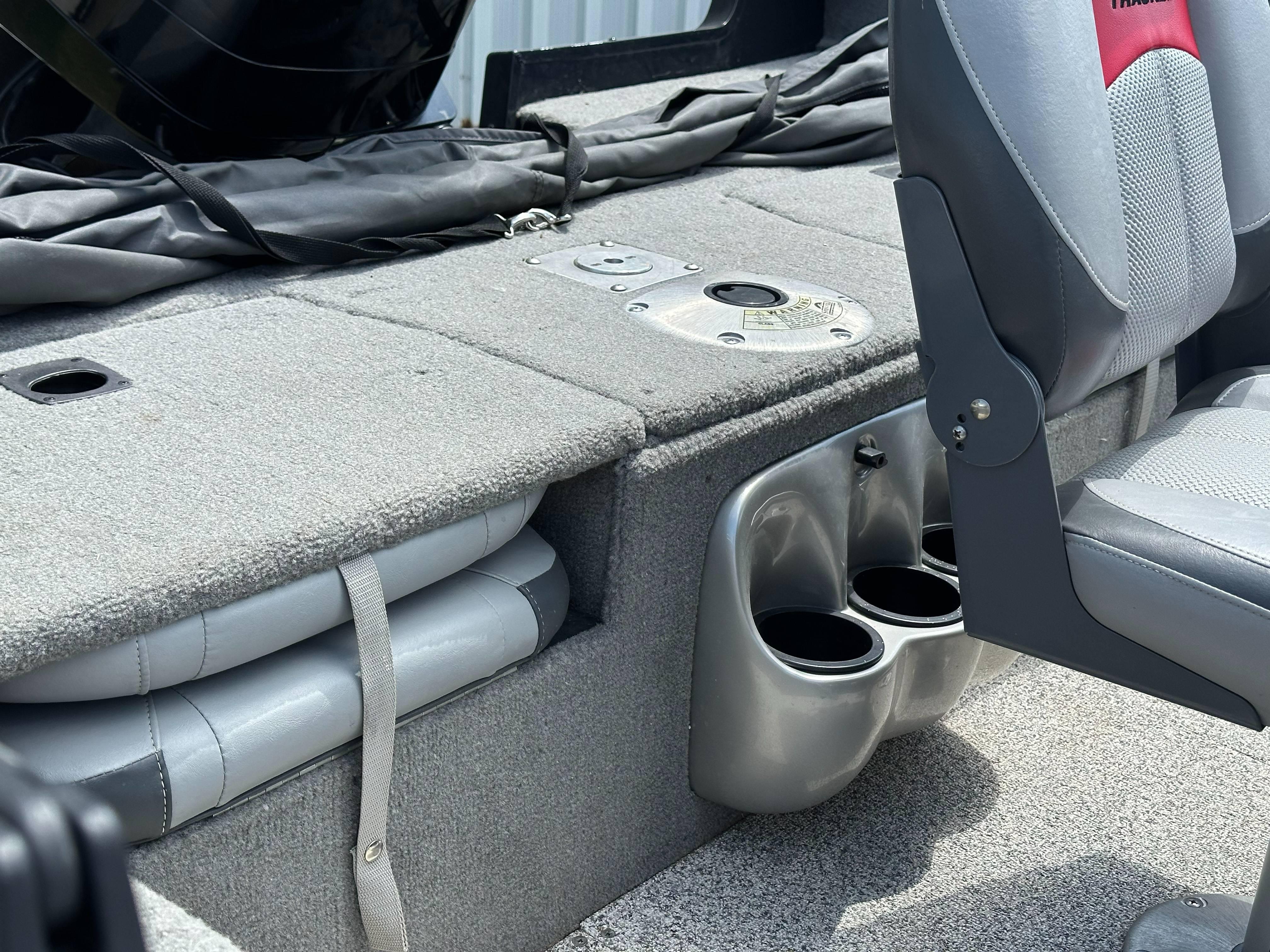 2013 Tracker Pro Guide V-175 WT boat interior with seating and cup holders.