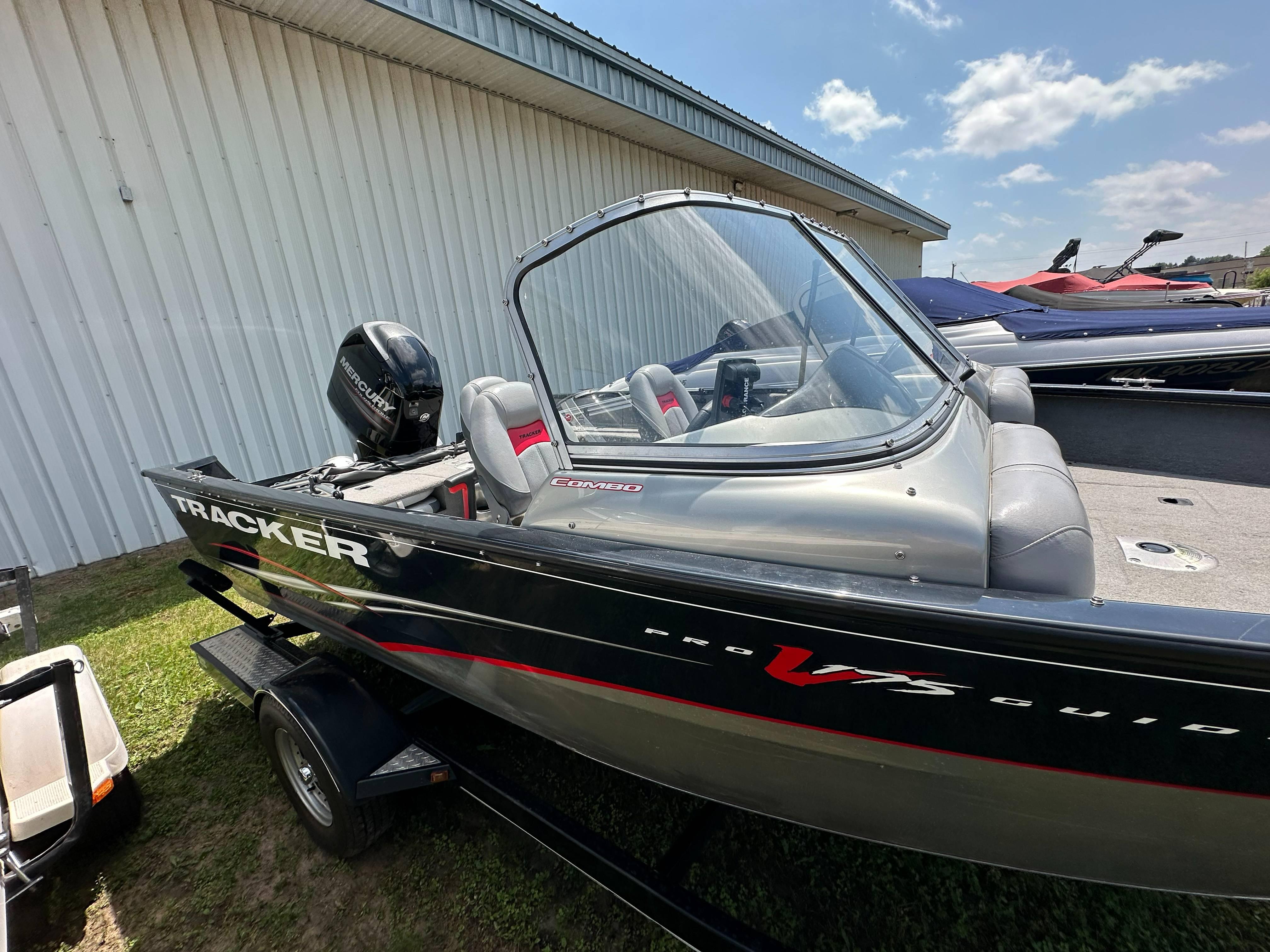 2013 Tracker Pro Guide V-175 WT boat with Mercury engine, parked outdoors.