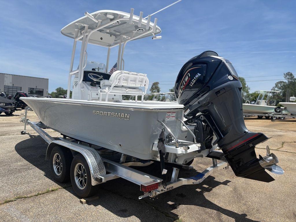 2024 Sportsman Masters 227 Bay boat on trailer with powerful outboard motor.