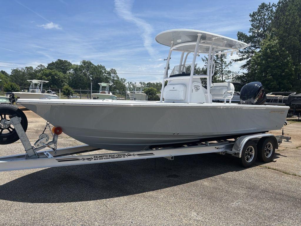 2024 Sportsman Masters 227 Bay boat on trailer, parked outdoors.