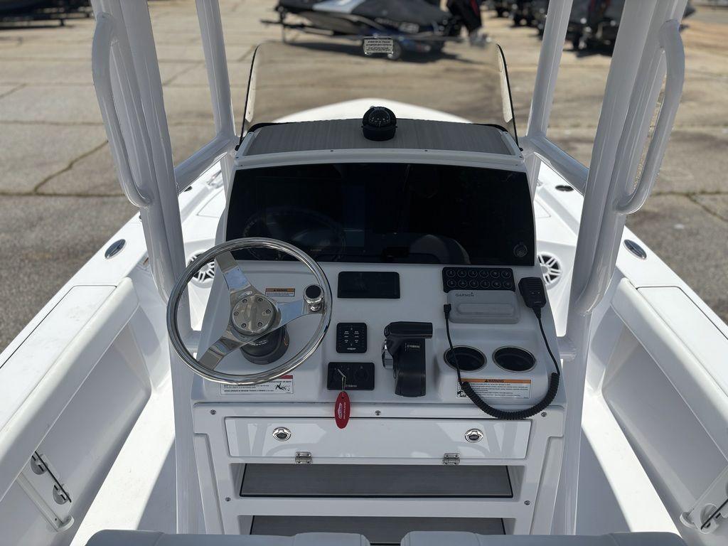 2024 Sportsman Masters 227 Bay boat console with steering wheel and controls.