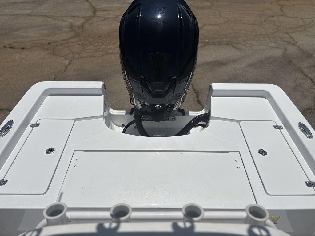 2024 Sportsman Masters 227 Bay boat with outboard motor, rear deck view.