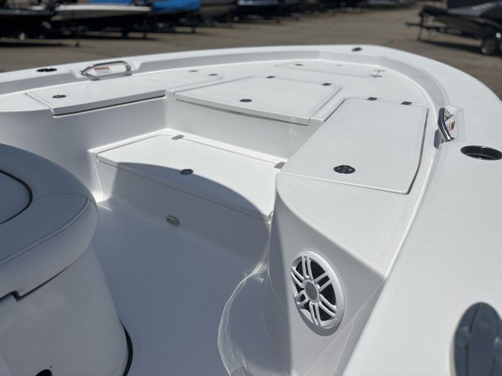 2024 Sportsman Masters 227 Bay boat interior with seating and storage compartments.