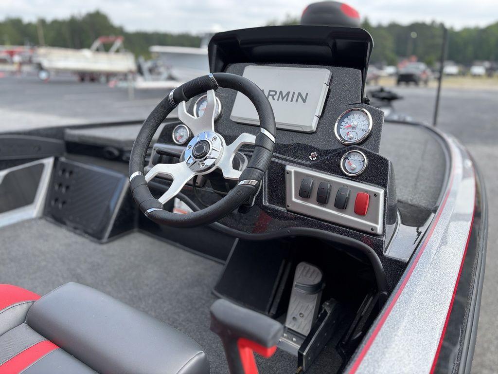 2025 Nitro Z19 Pro boat dashboard with steering wheel and Garmin display.