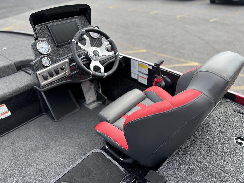 2025 Nitro Z19 Pro boat interior with steering wheel and red-accented seat.