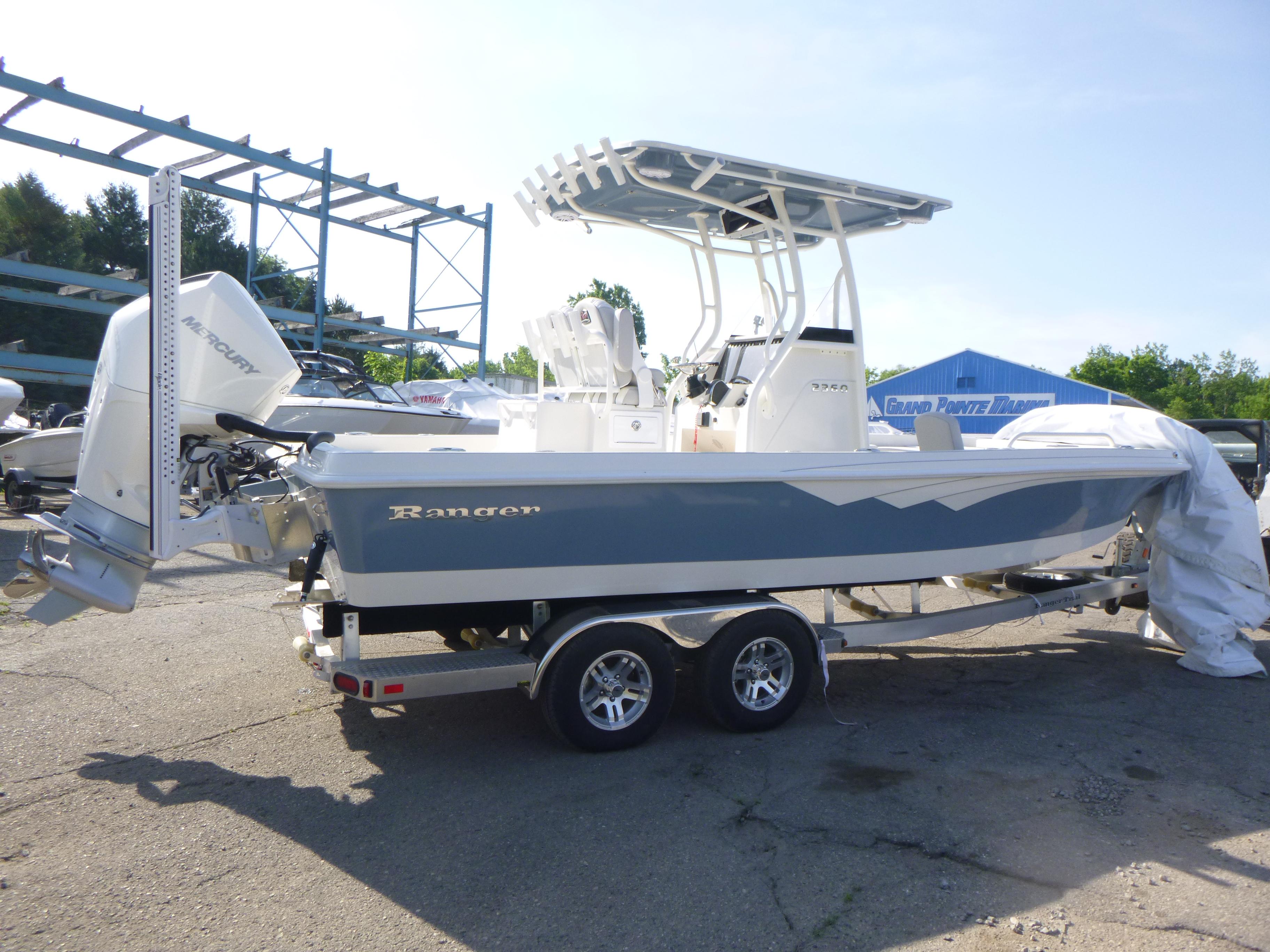 2024 Ranger 2360 Bay Ranger boat on trailer, featuring Mercury outboard motor.