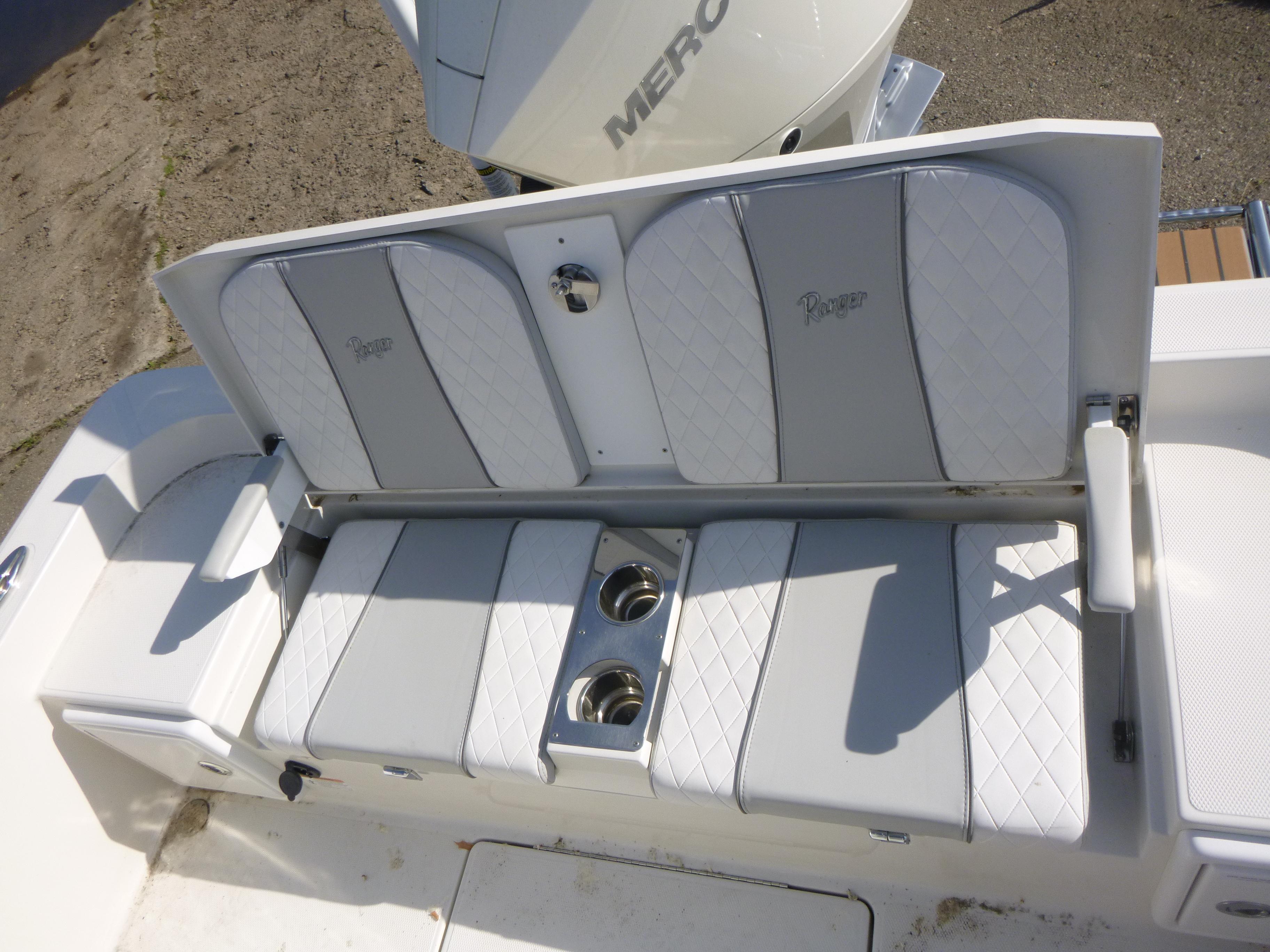 2024 Ranger 2360 Bay Ranger boat seating with cup holders, featuring white and gray upholstery.