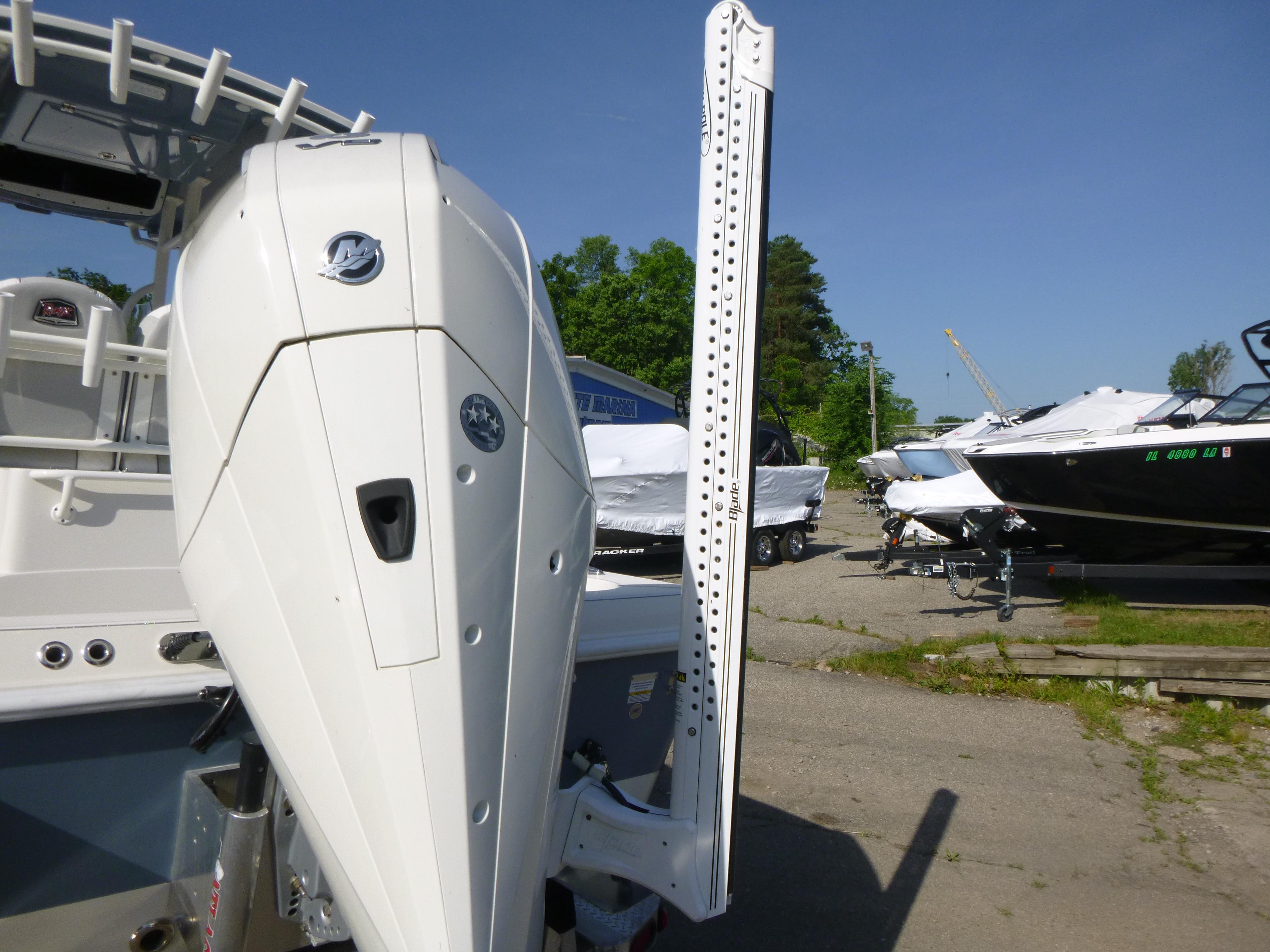 2024 Ranger 2360 Bay Ranger boat with powerful outboard motor in a marina setting.