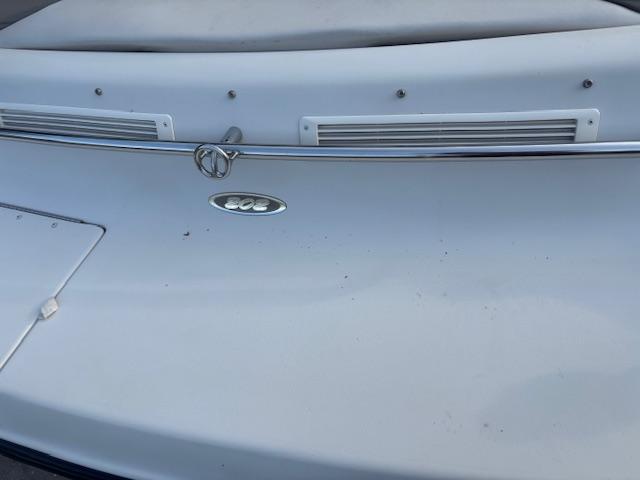 1999 Crownline 202 boat stern with chrome rail and logo detail.