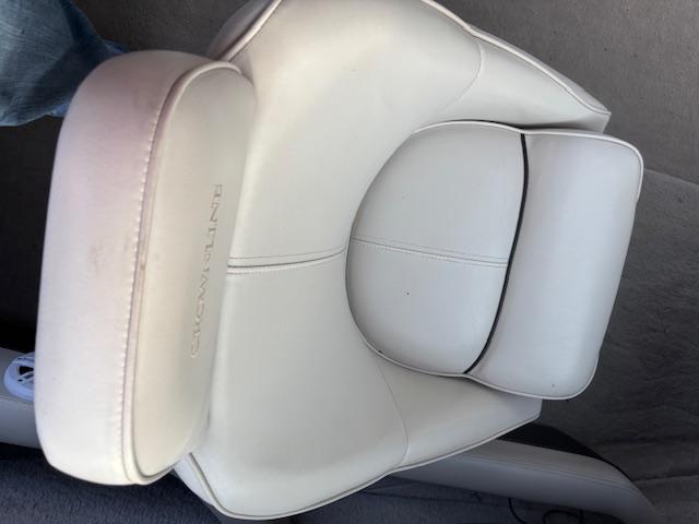 White leather seat in a 1999 Crownline 202 boat.