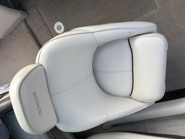 White leather seat in a 1999 Crownline 202 boat interior.