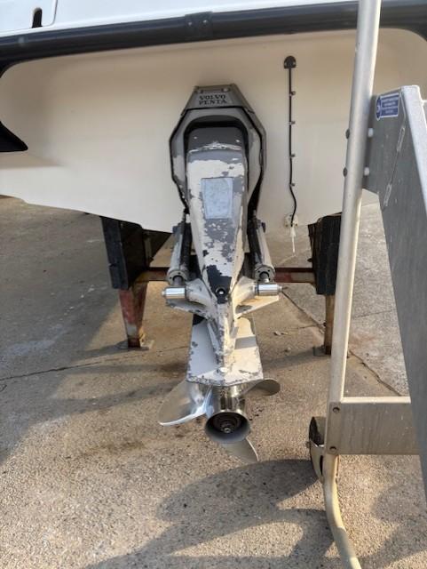 1999 Crownline 202 boat stern drive on a trailer, showing propeller and lower unit.