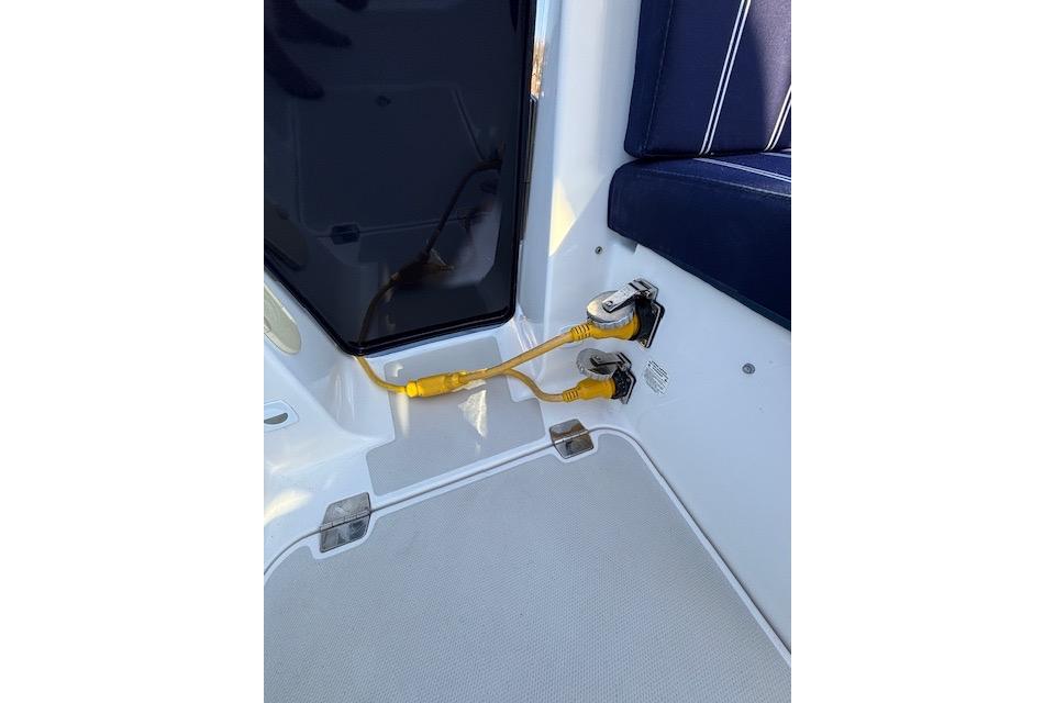 2018 Back Cove 30 boat interior with electrical connections and seating.