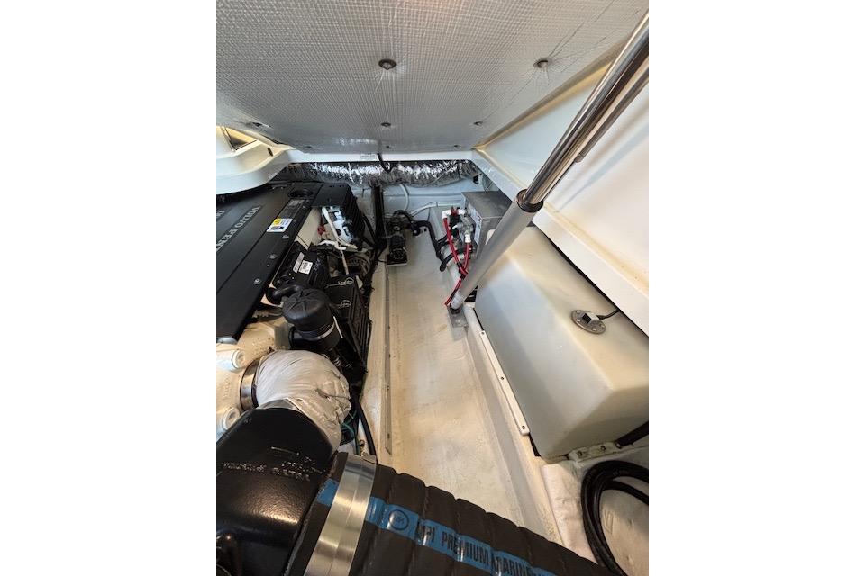 Engine compartment of a 2018 Back Cove 30 boat, showcasing mechanical components.