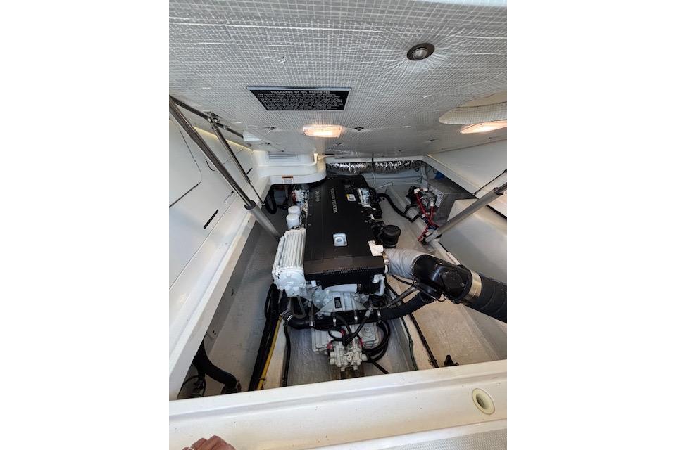 Engine compartment of a 2018 Back Cove 30 boat, showcasing mechanical components.