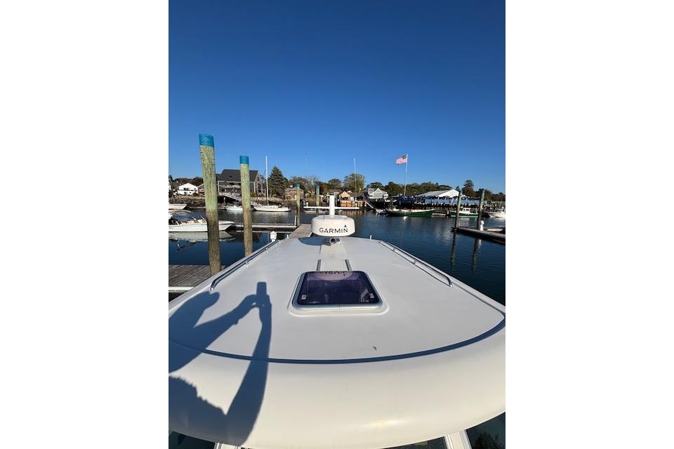2018 Back Cove 30 boat docked at marina under clear blue sky.