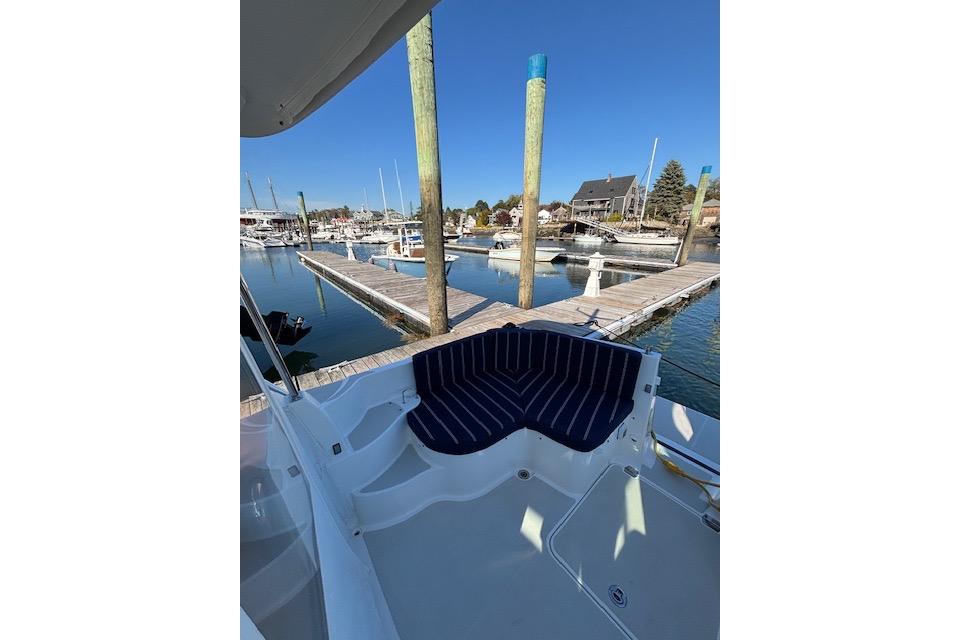 2018 Back Cove 30 boat with striped seating at a marina dock.
