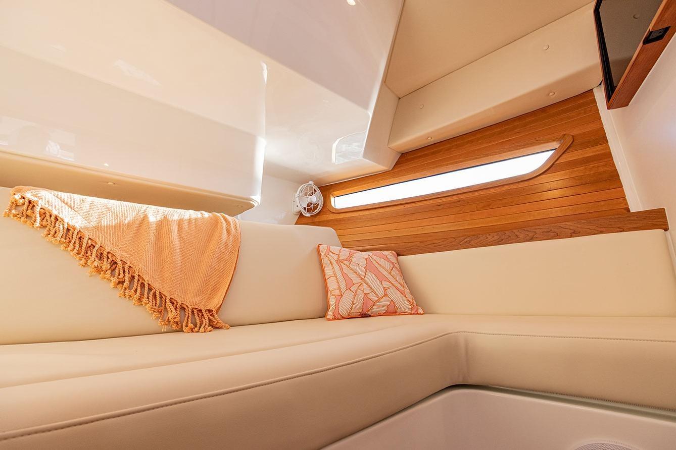 Luxurious interior of 2025 MJM 4 yacht with cozy seating and elegant decor.
