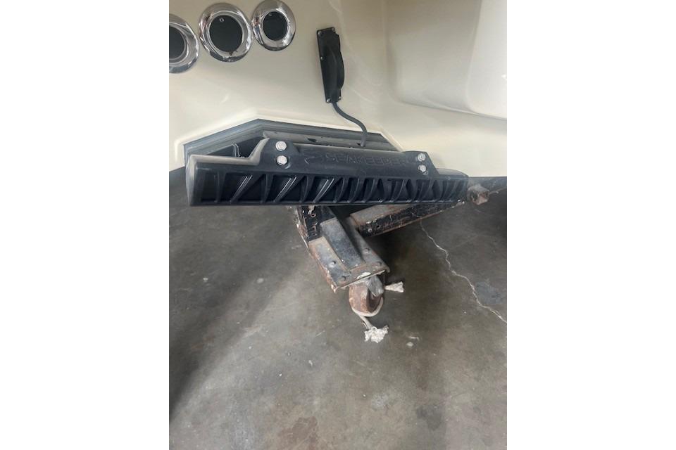 2024 Chris-Craft Catalina 28 boat detail showing hull and trailer connection.