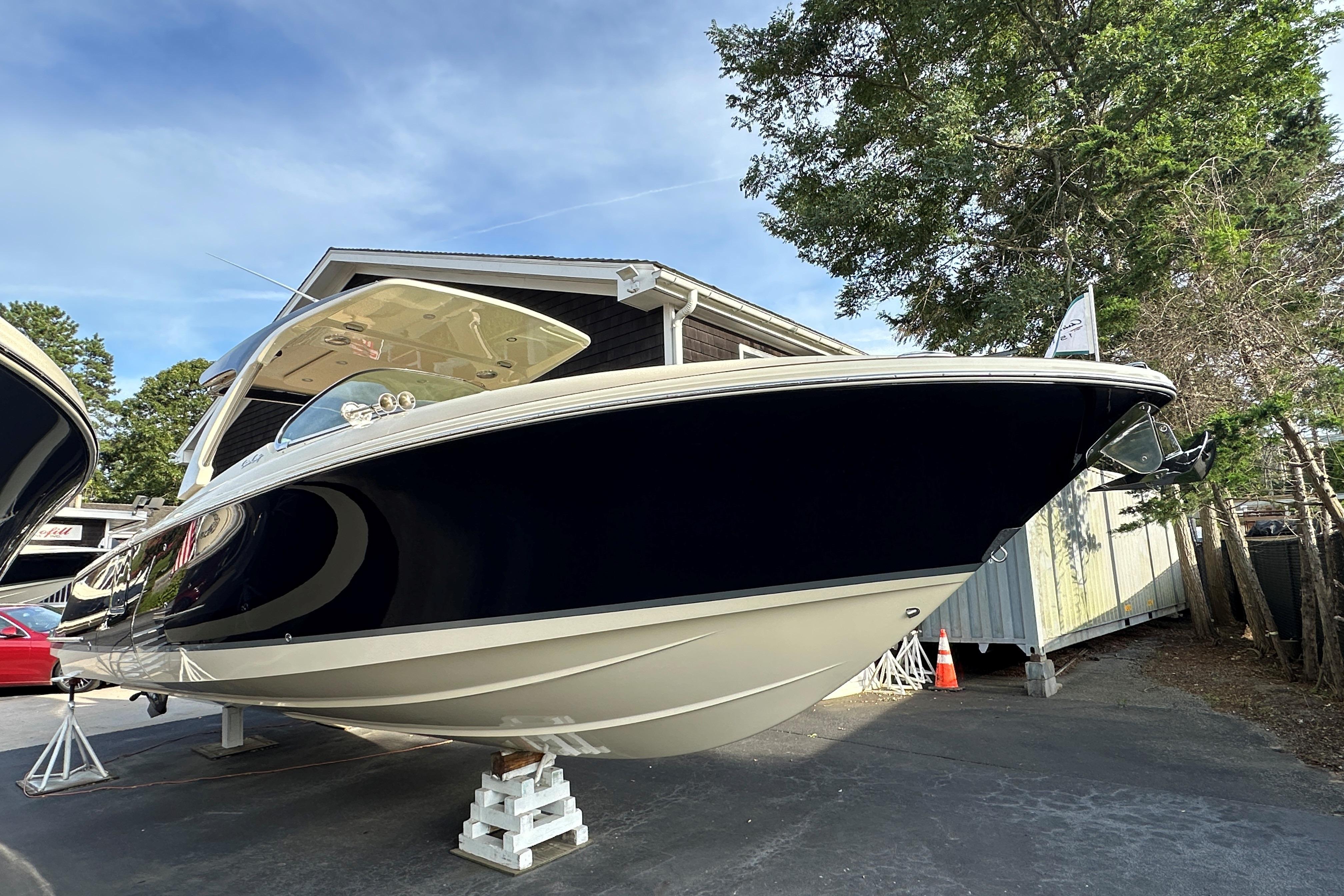 2025 Chris-Craft Launch 31 GT boat displayed outdoors on stands.