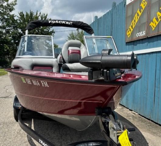 2015 Tracker Targa V-18 Combo boat, red, parked on trailer, sunny day.
