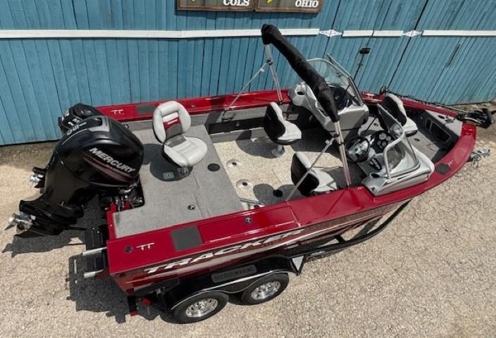 2015 Tracker Targa V-18 Combo boat with Mercury engine, red exterior, parked on trailer.