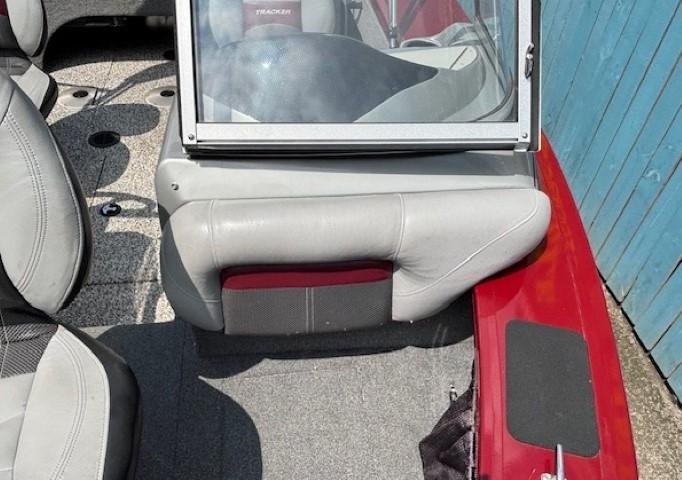 2015 Tracker Targa V-18 Combo boat interior with gray seating and red accents.