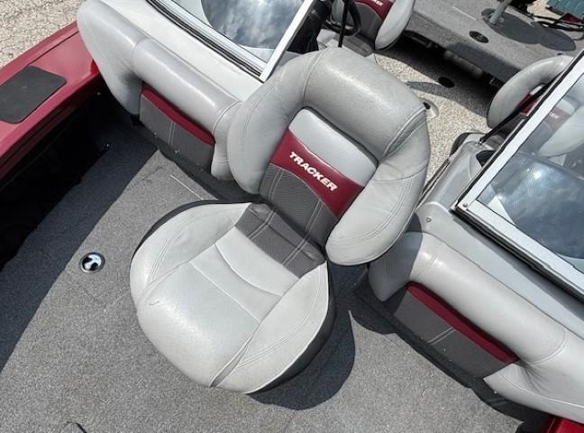 2015 Tracker Targa V-18 Combo boat seat, gray and red upholstery, on deck.