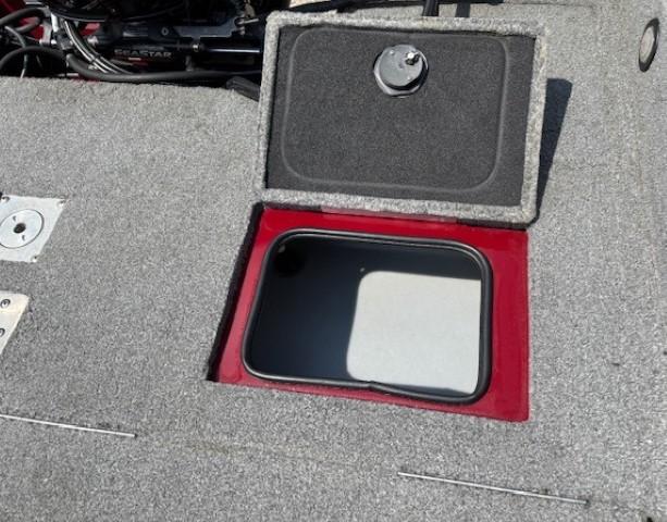 Open storage compartment on 2015 Tracker Targa V-18 Combo boat deck.