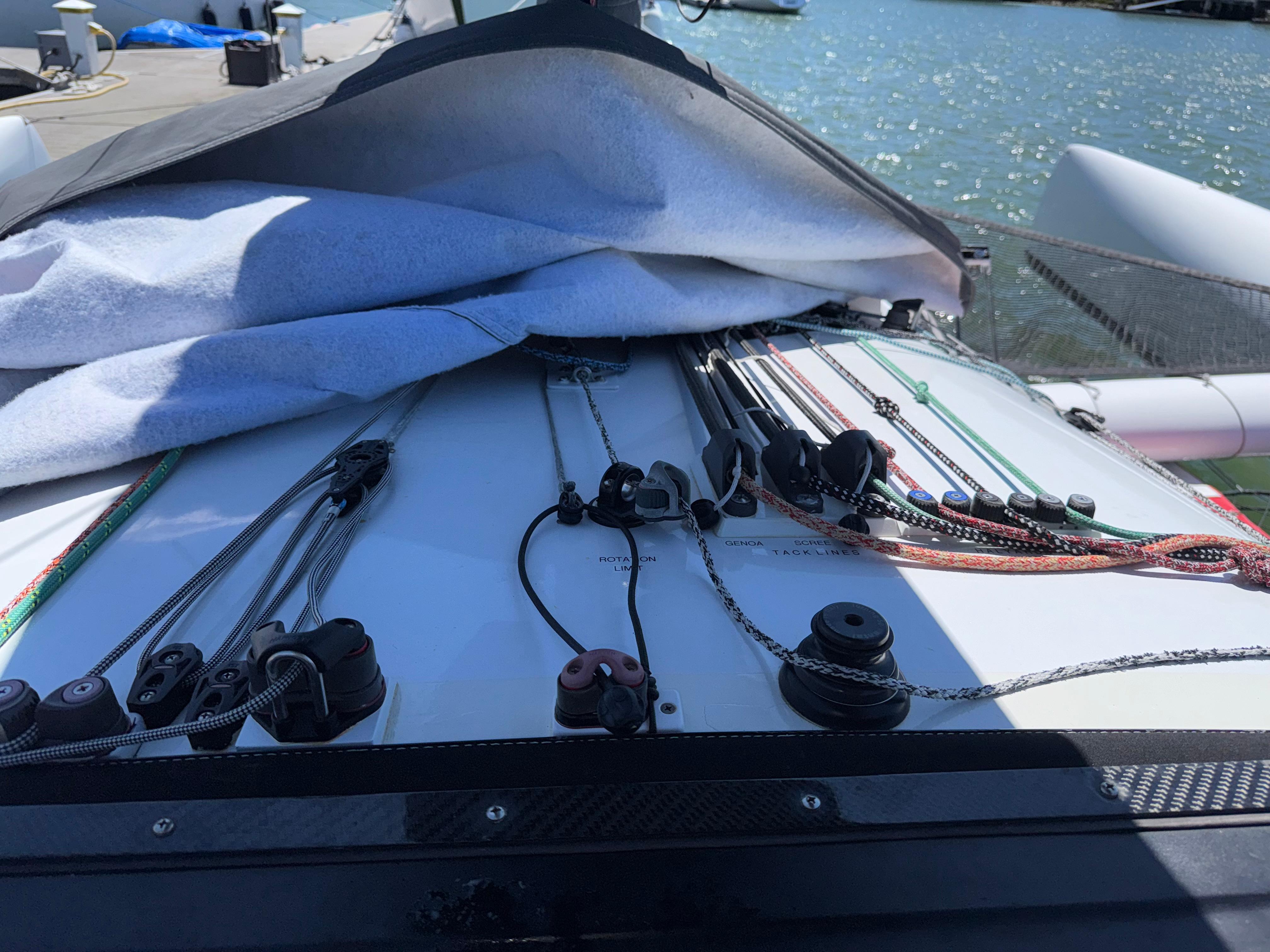 Close-up of Marstrom Seacart 30 sailboat deck with ropes and pulleys, 2015 model.