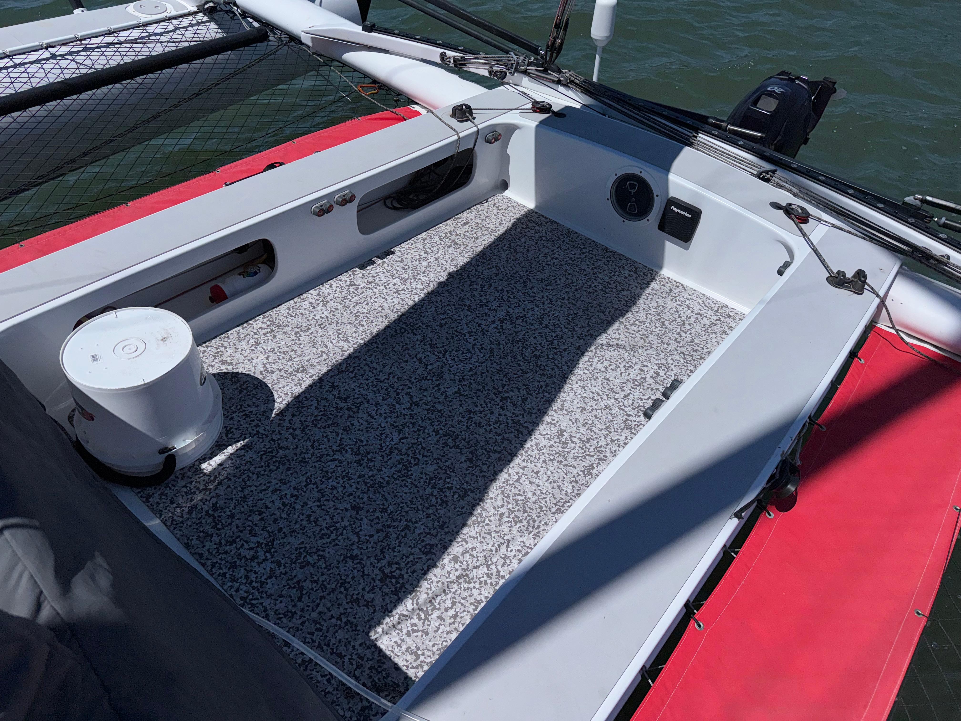 Cockpit of 2015 Marstrom Seacart 30 sailboat with red and gray detailing.