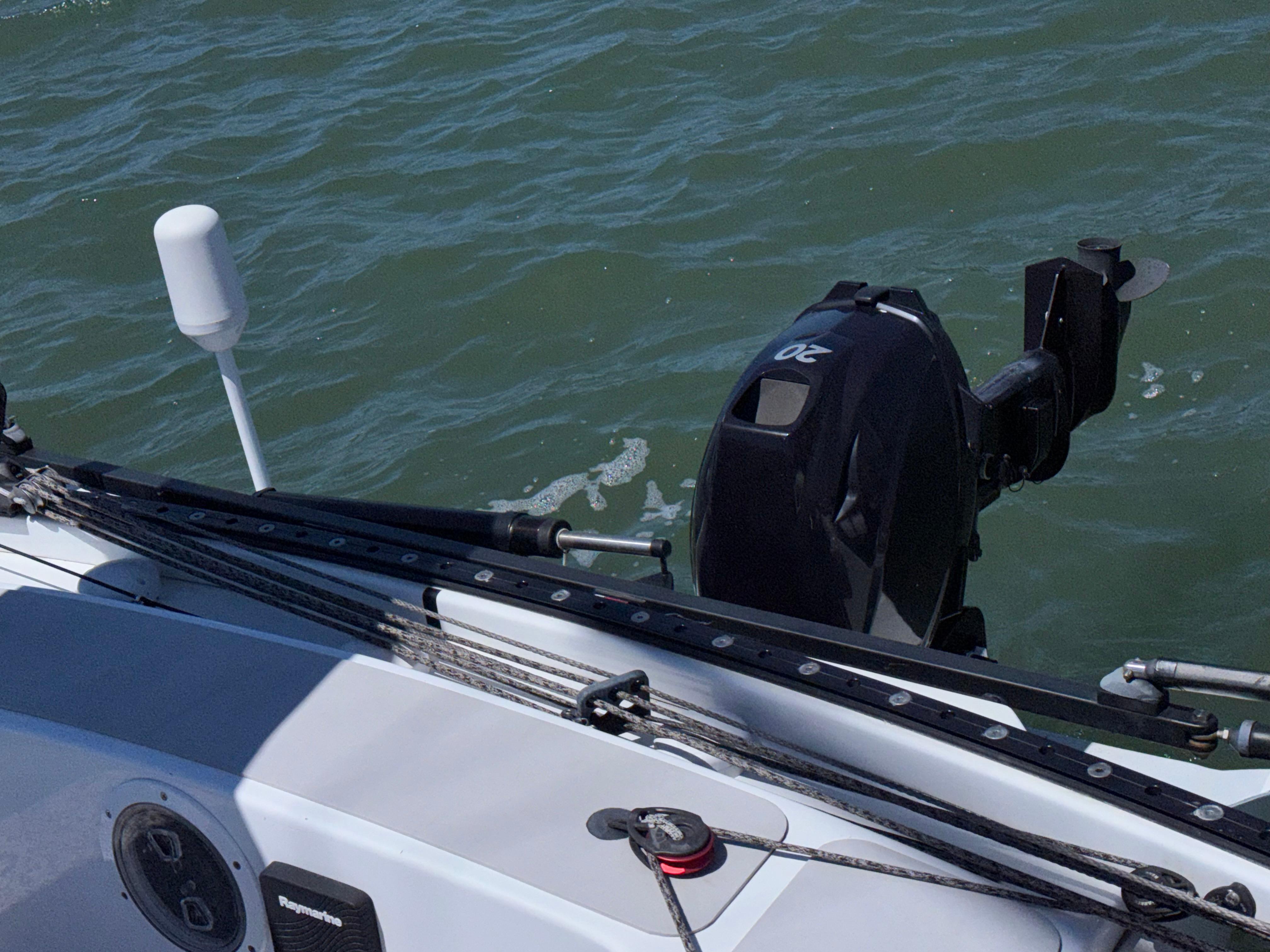 Marstrom Seacart 30 sailboat with outboard motor on water, 2015 model.