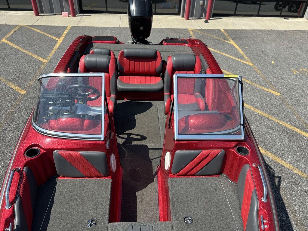 Red and black 2013 Stratos 486 SF boat interior with seating and windshield.