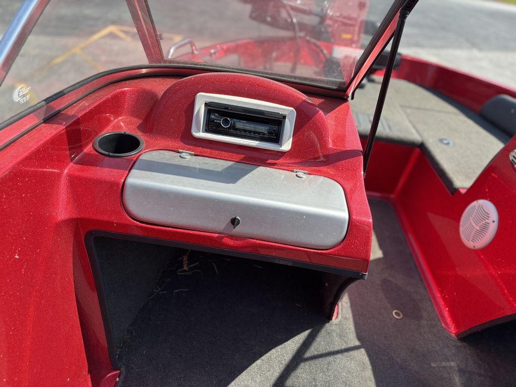 Red Stratos 486 SF boat interior, featuring dashboard and cup holder, 2013 model.
