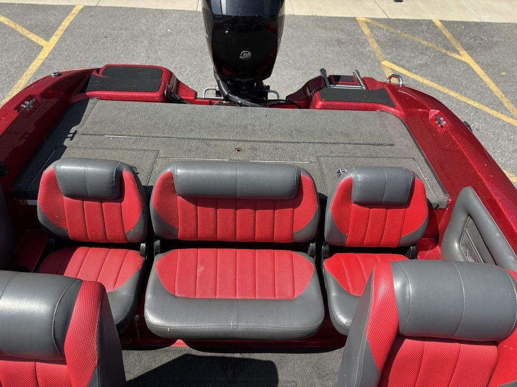 Red and gray seating in a 2013 Stratos 486 SF boat, viewed from above.