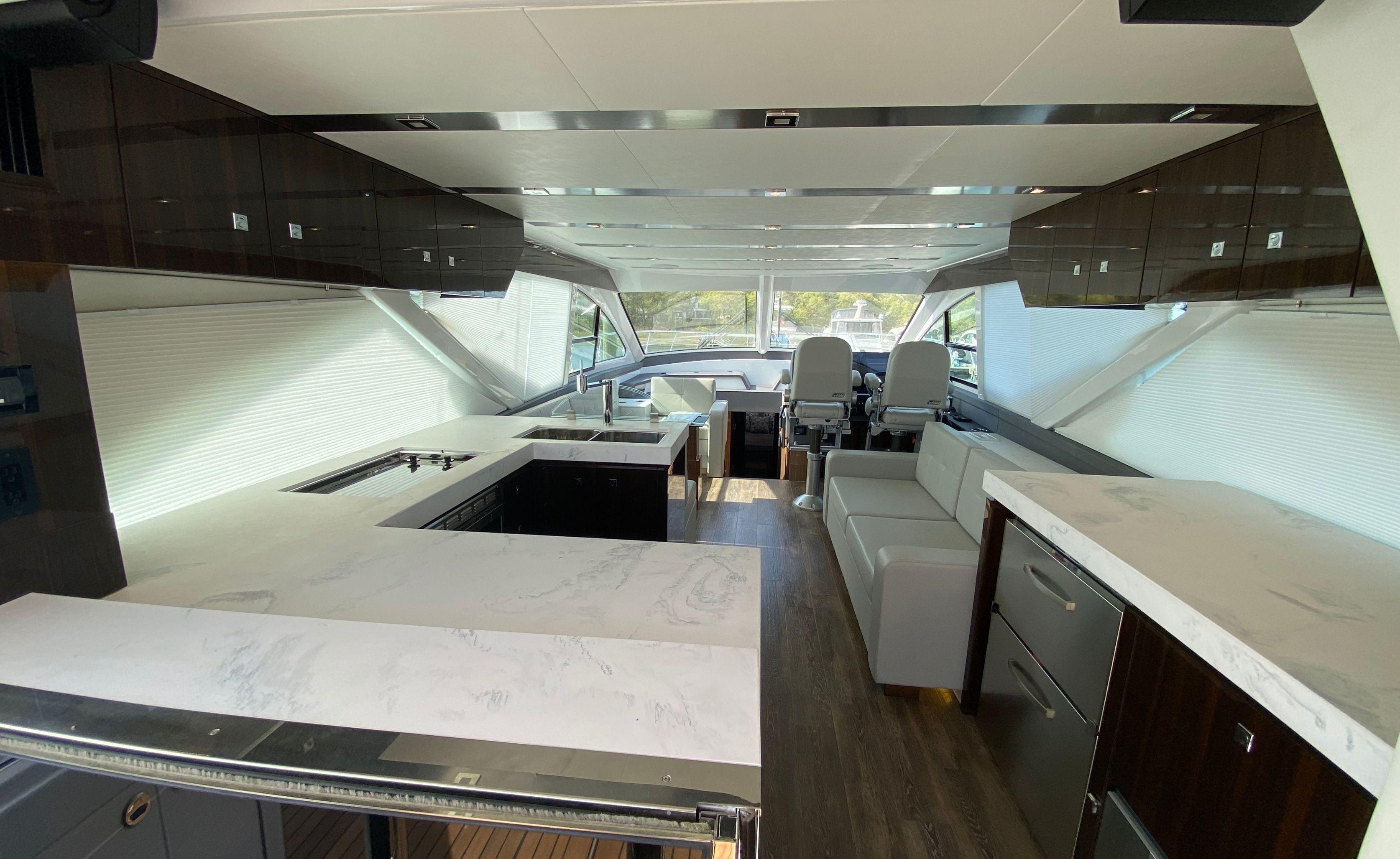 Cruisers Yachts-60 Fly 2022-RADIANT NY-US-Luxurious interior of 2022 Cruisers Yachts 60 Fly with modern kitchen and seating area.-9652120 | Thumbnail