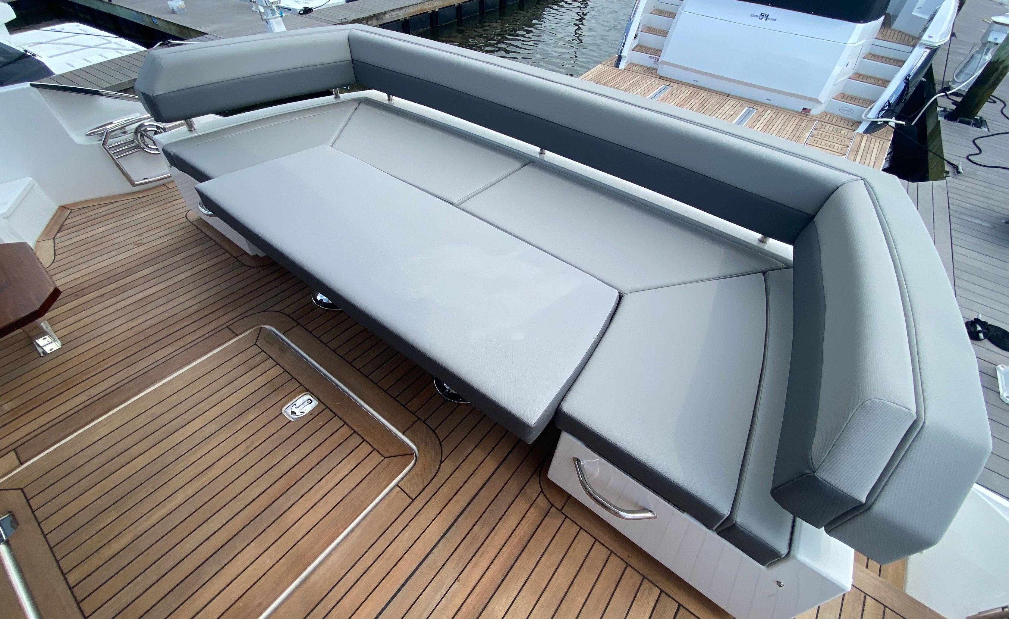 Cruisers Yachts-60 Fly 2022-RADIANT NY-US-Luxurious seating on 2022 Cruisers Yachts 60 Fly, featuring sleek design and teak flooring.-9652120 | Thumbnail