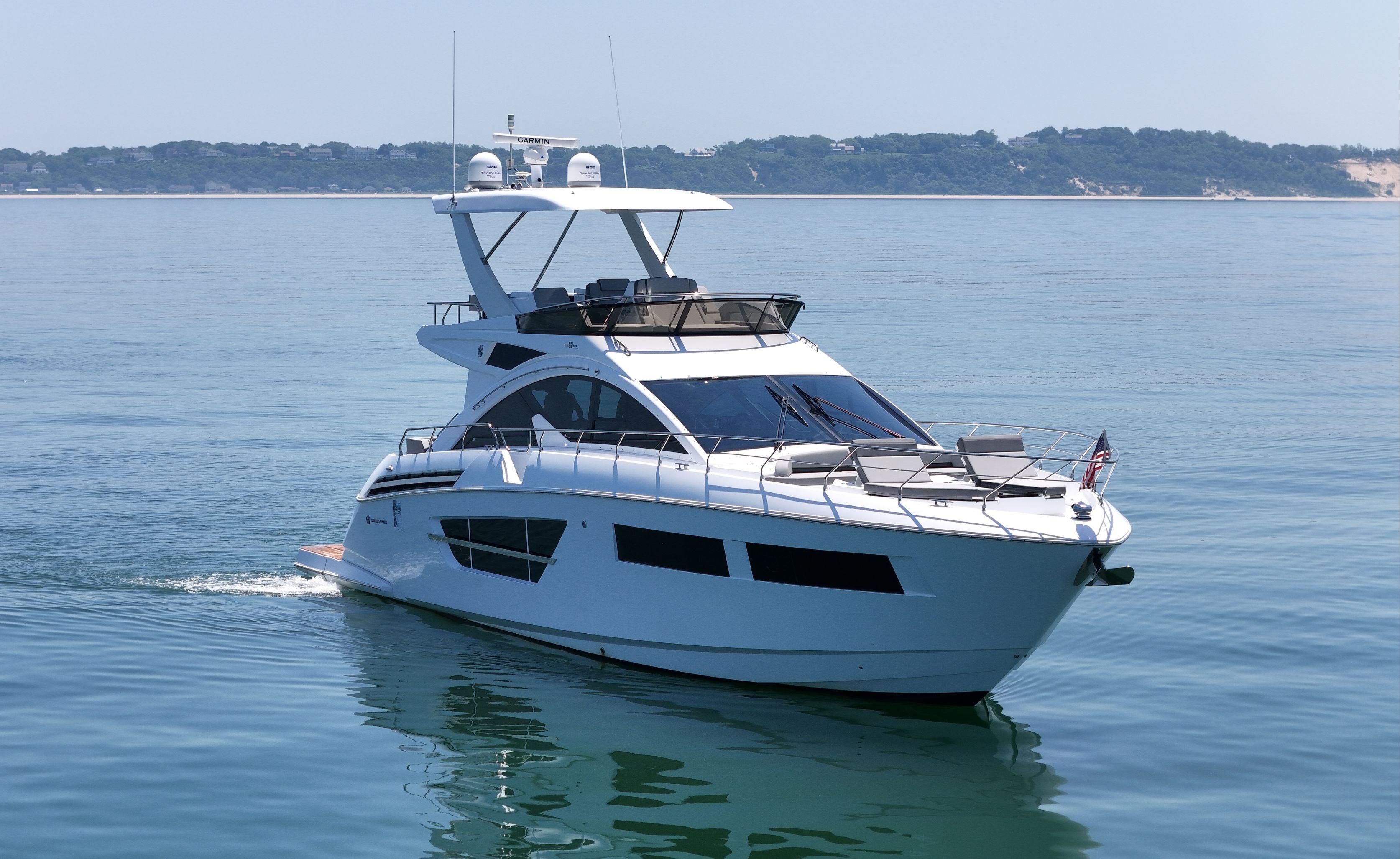 Cruisers Yachts-60 Fly 2022-RADIANT NY-US-2022 Cruisers Yachts 60 Fly on calm water, showcasing sleek design and luxury features.-9652120 | Thumbnail