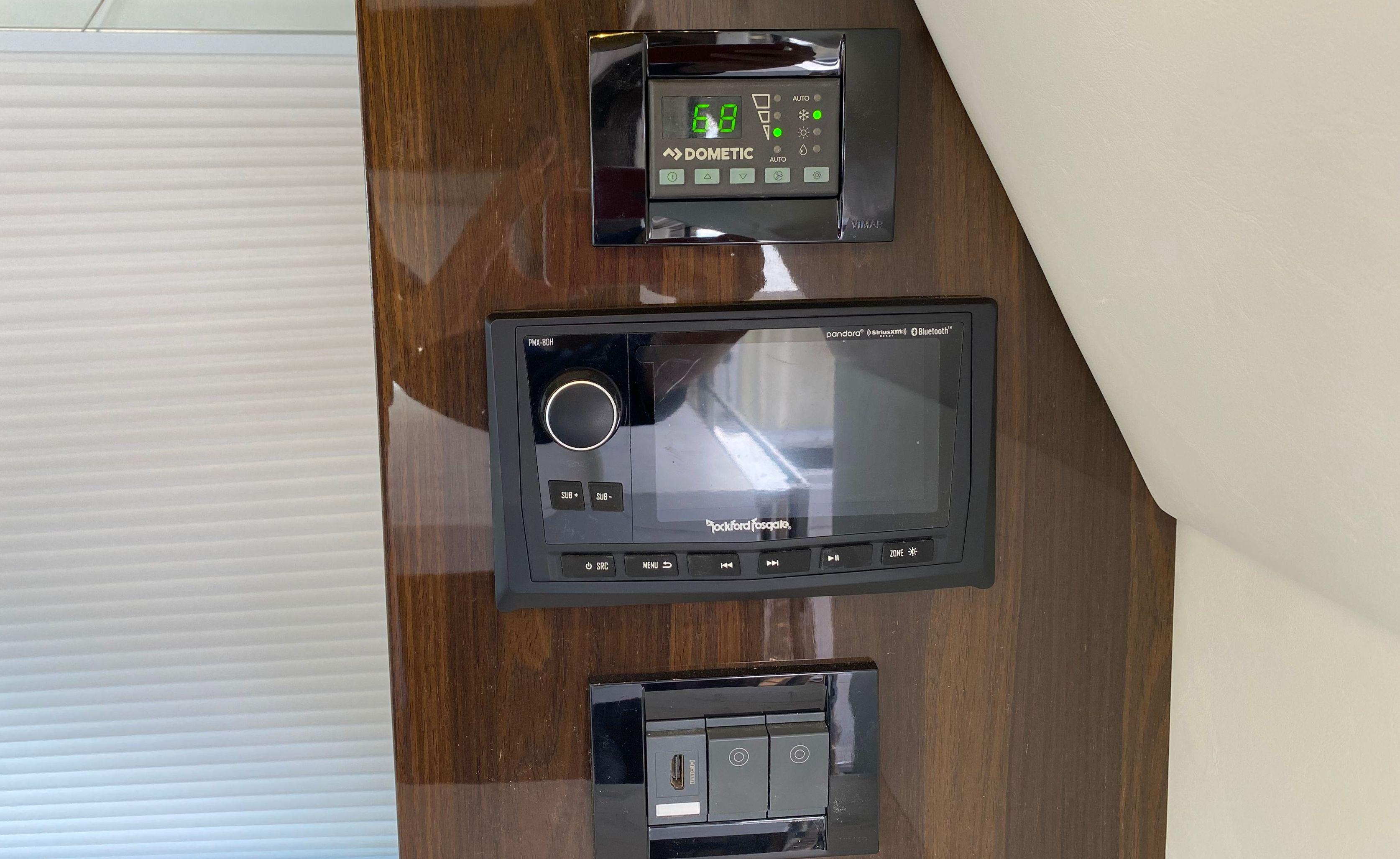 Cruisers Yachts-60 Fly 2022-RADIANT NY-US-Control panel on 2022 Cruisers Yachts 60 Fly, featuring Dometic and Rockford Fosgate systems.-9652120 | Thumbnail