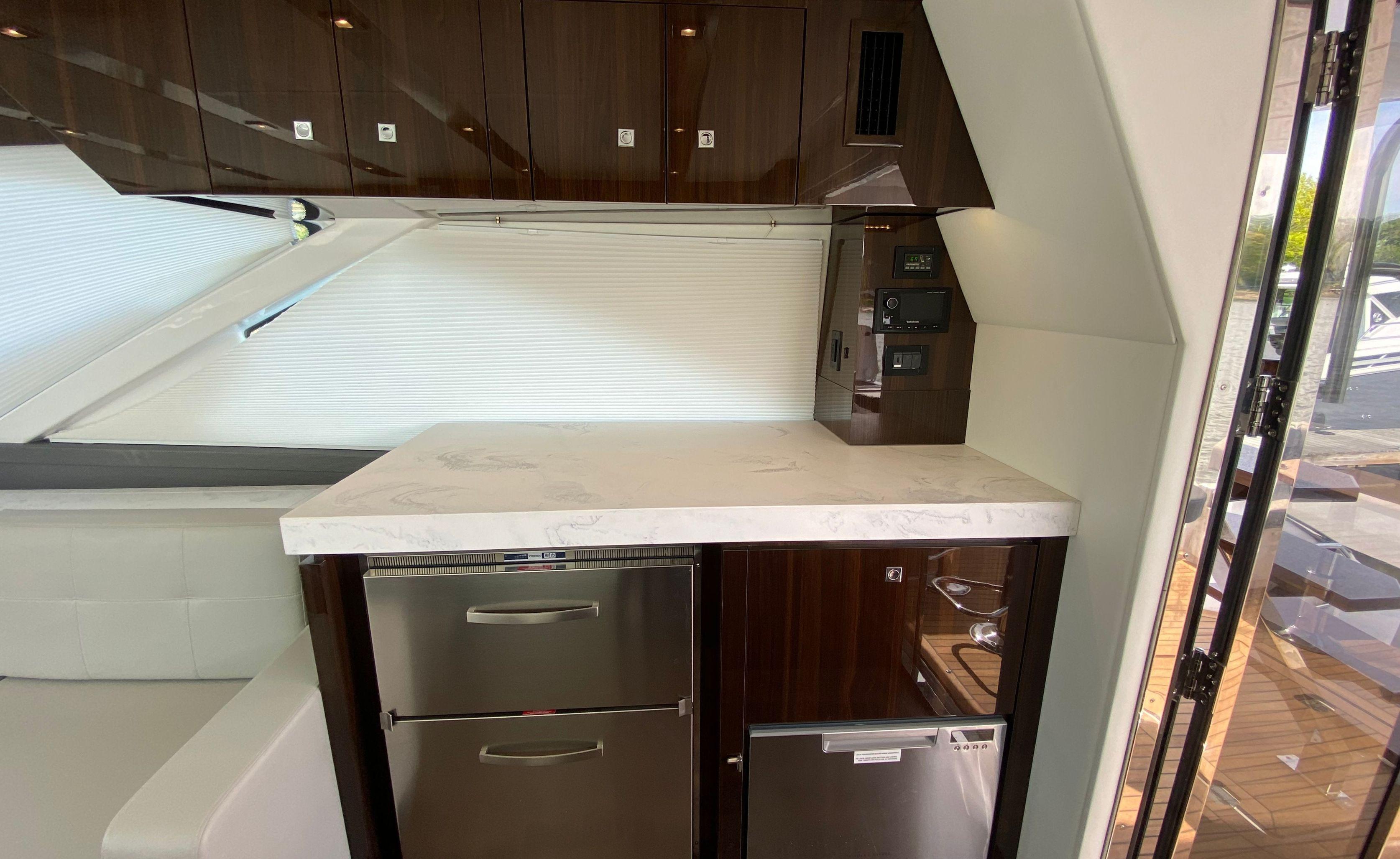 Cruisers Yachts-60 Fly 2022-RADIANT NY-US-Luxurious kitchen area in 2022 Cruisers Yachts 60 Fly with modern appliances and sleek cabinetry.-9652120 | Thumbnail