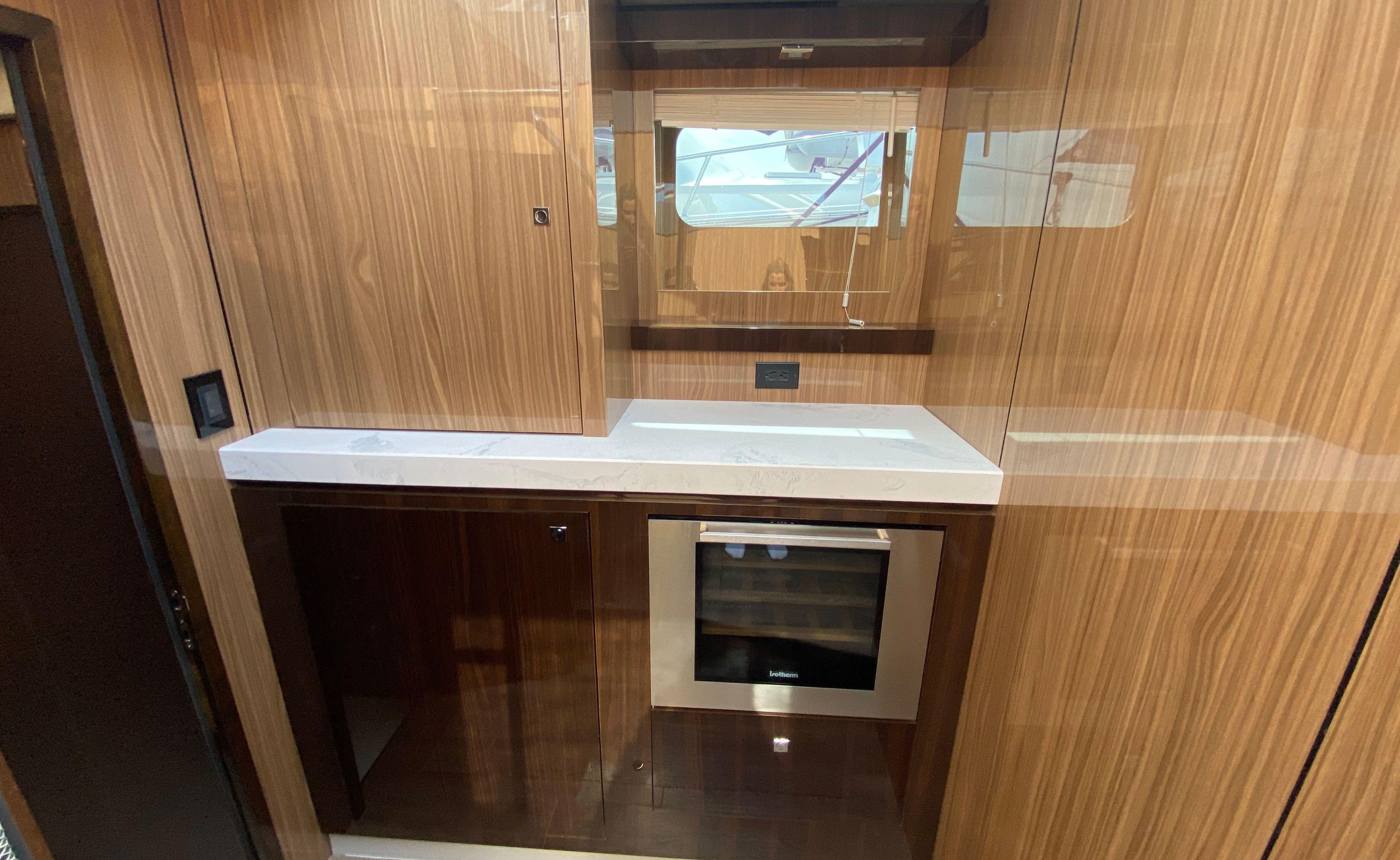 Cruisers Yachts-60 Fly 2022-RADIANT NY-US-Luxurious 2022 Cruisers Yachts 60 Fly kitchen with wood cabinetry and modern appliances.-9652120 | Thumbnail