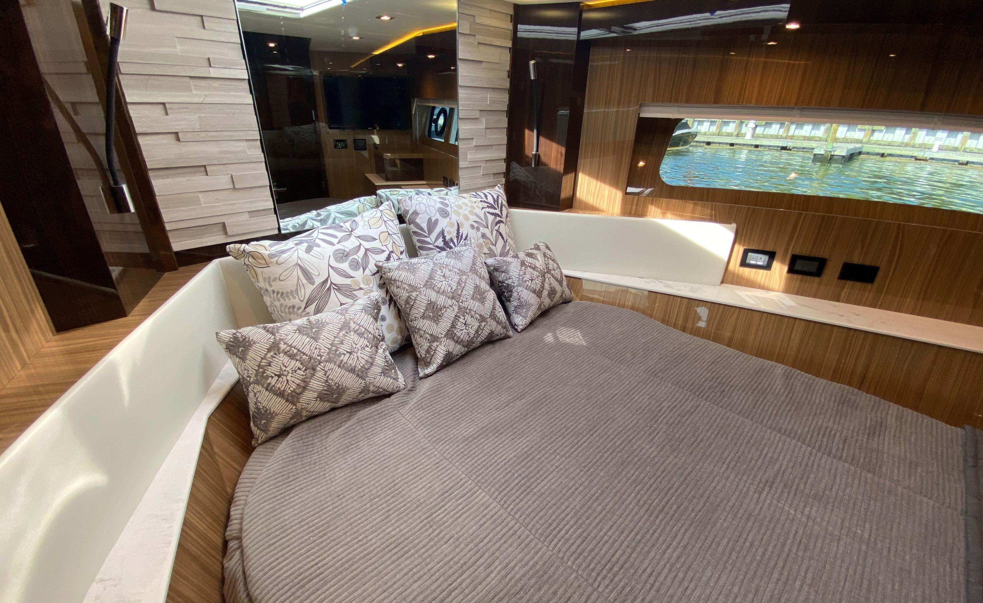Cruisers Yachts-60 Fly 2022-RADIANT NY-US-Luxurious bedroom interior of 2022 Cruisers Yachts 60 Fly with elegant bedding and window view.-9652120 | Thumbnail