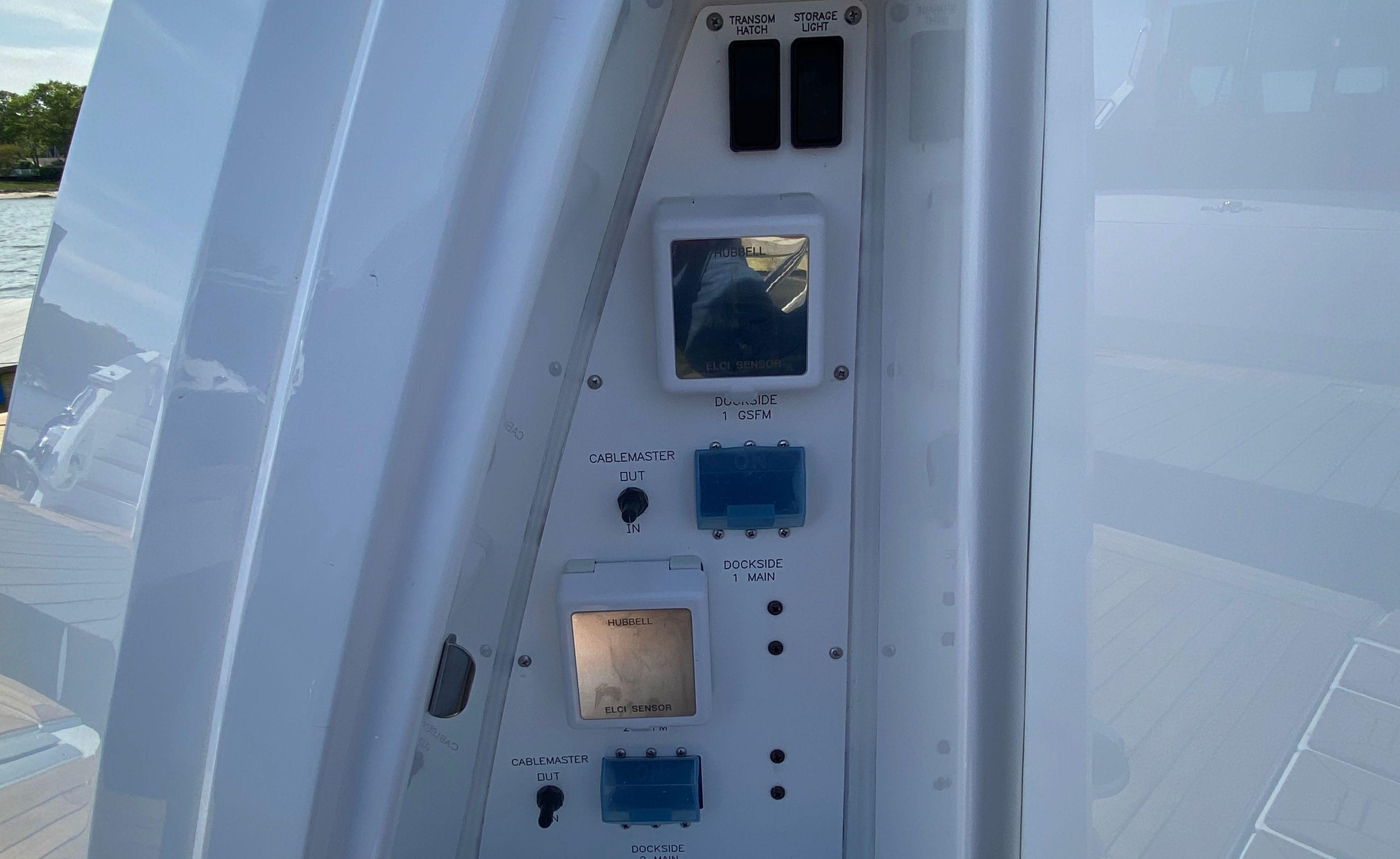 Cruisers Yachts-60 Fly 2022-RADIANT NY-US-Control panel on 2022 Cruisers Yachts 60 Fly, featuring switches and electrical outlets.-9652120 | Thumbnail