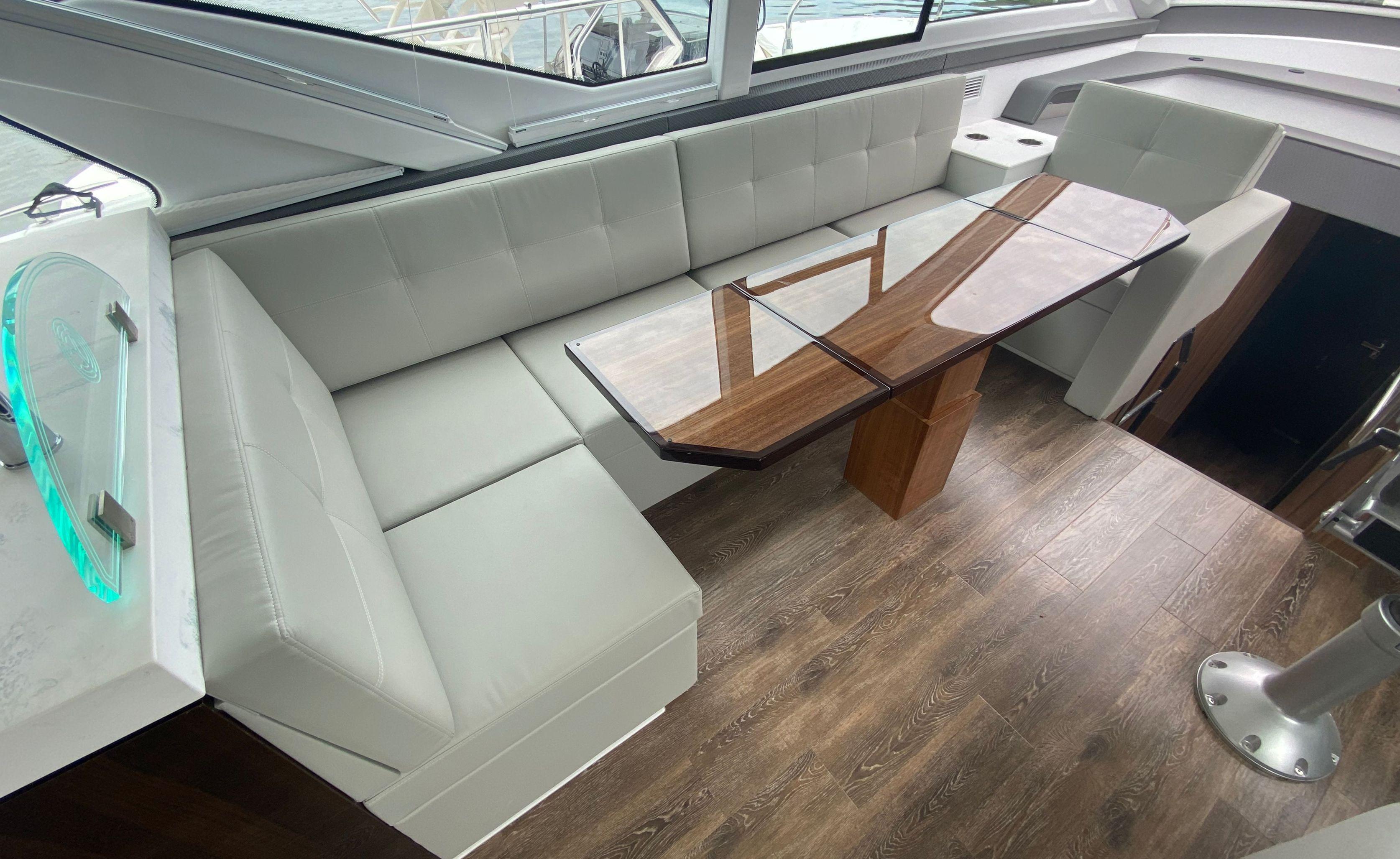 Cruisers Yachts-60 Fly 2022-RADIANT NY-US-Luxurious interior of 2022 Cruisers Yachts 60 Fly with elegant seating and wooden table.-9652120 | Thumbnail