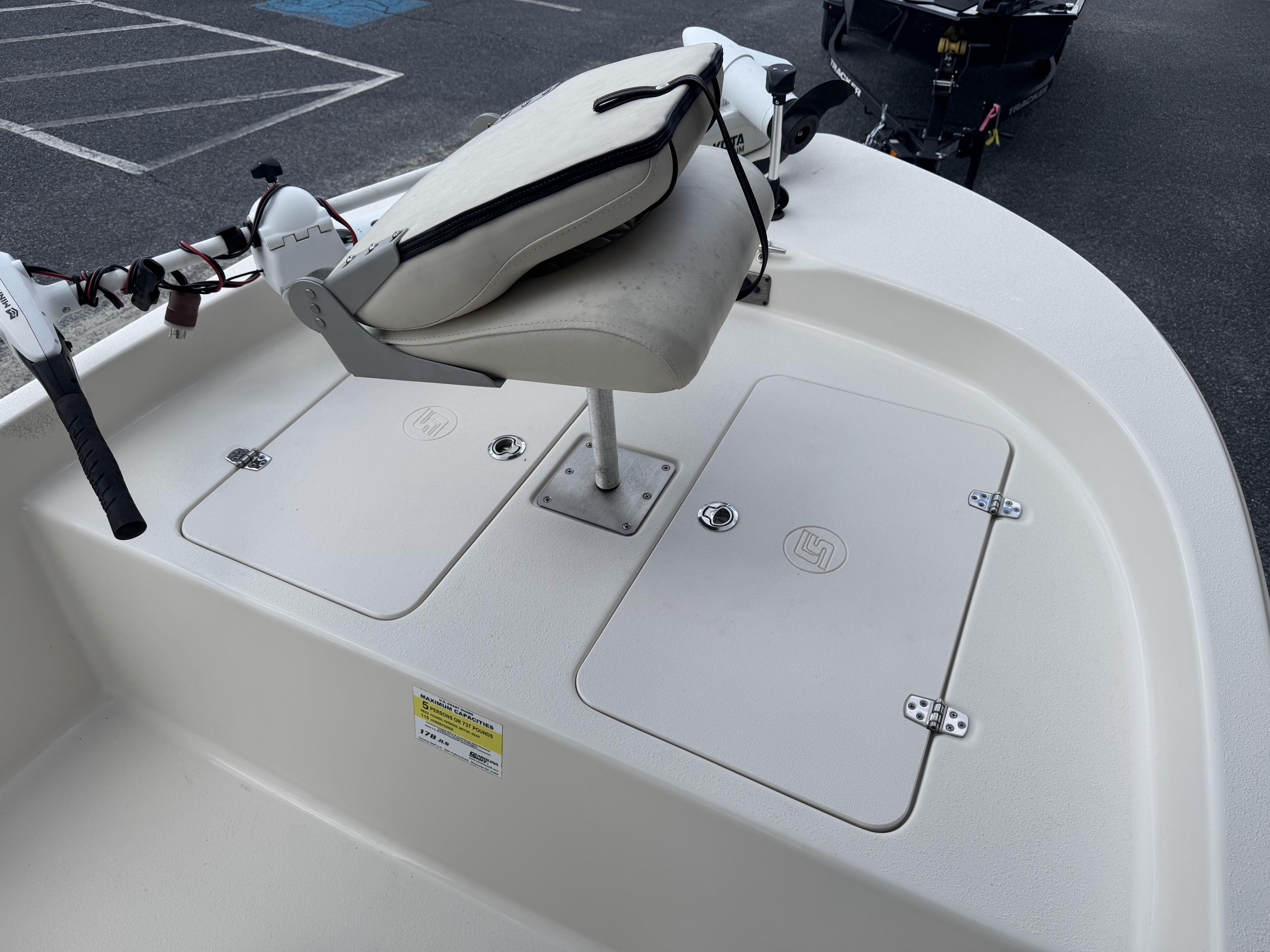 2020 Carolina Skiff 178JLS boat deck with seating and storage compartments.