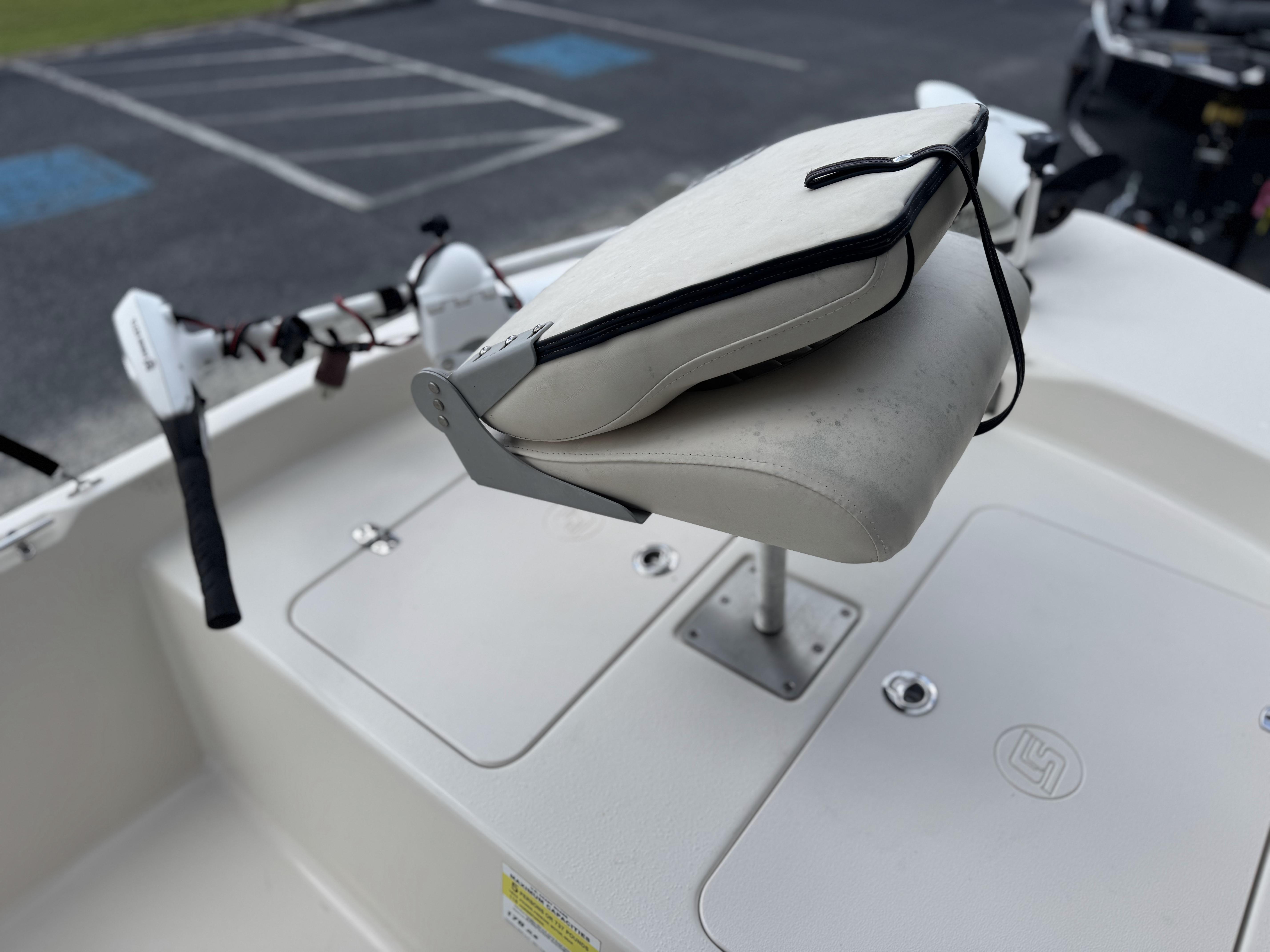 2020 Carolina Skiff 178JLS boat seat and deck, featuring storage compartments.