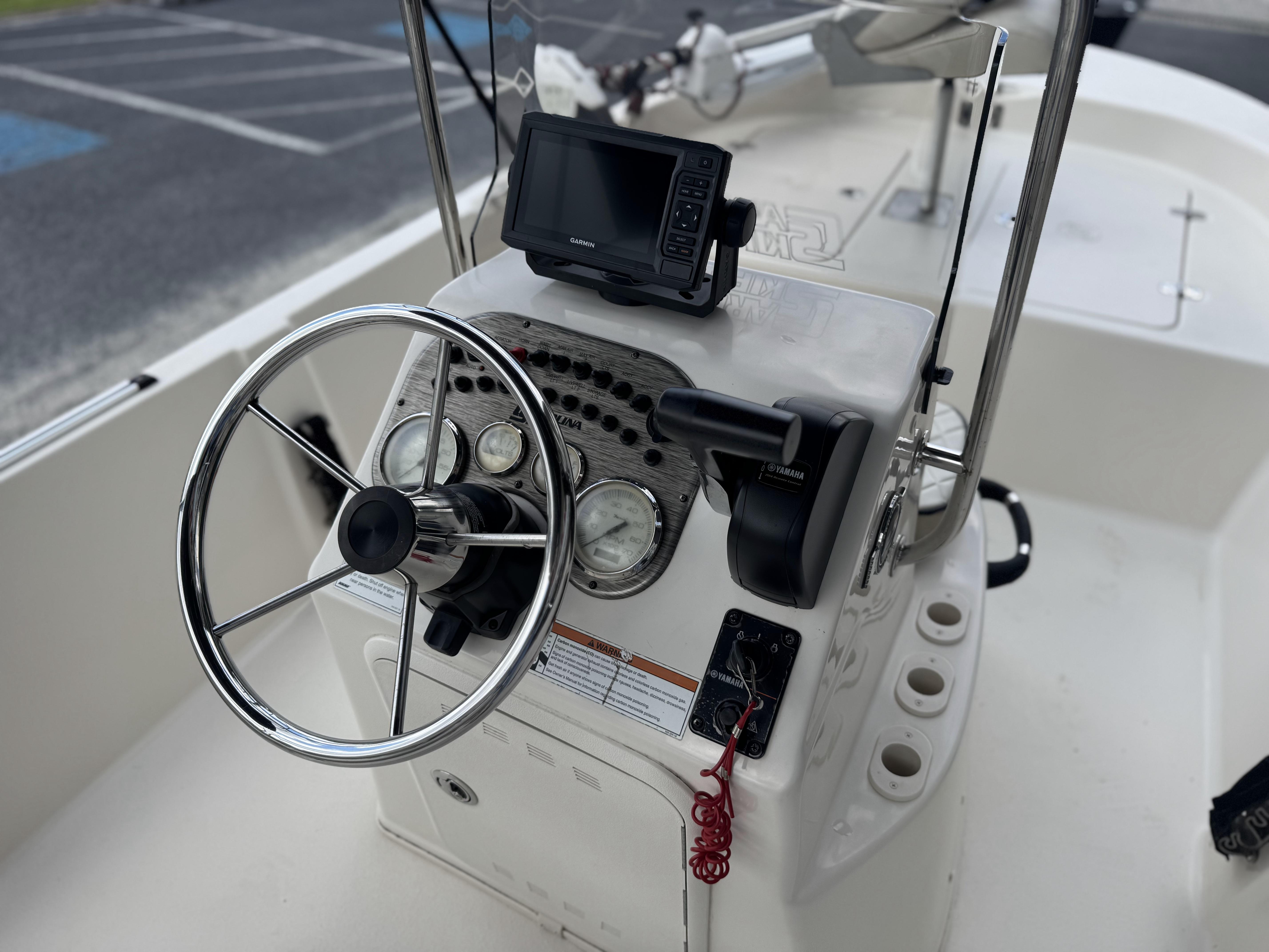 2020 Carolina Skiff 178JLS boat console with steering wheel and navigation system.
