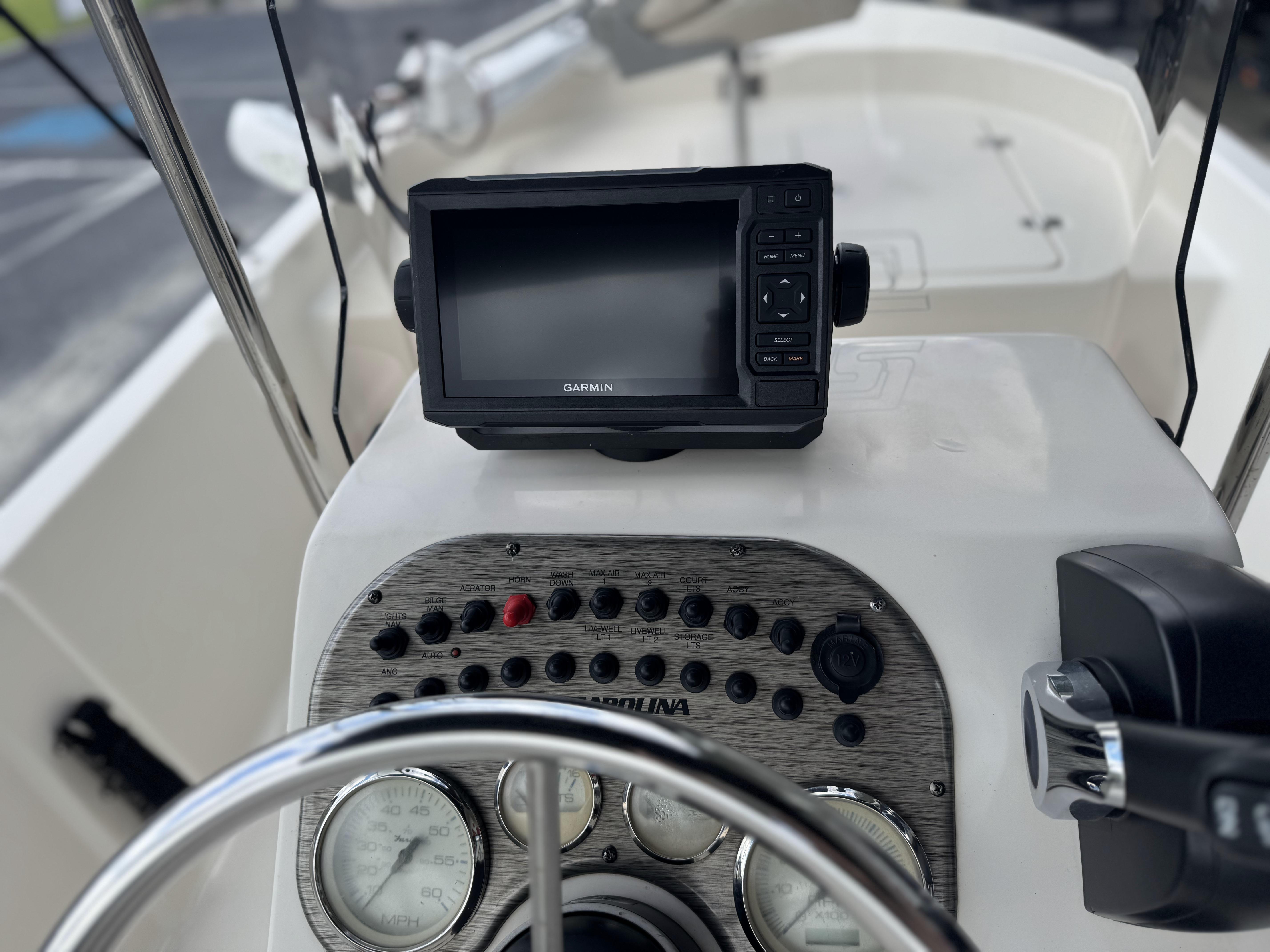 2020 Carolina Skiff 178JLS boat dashboard with Garmin GPS and control panel.