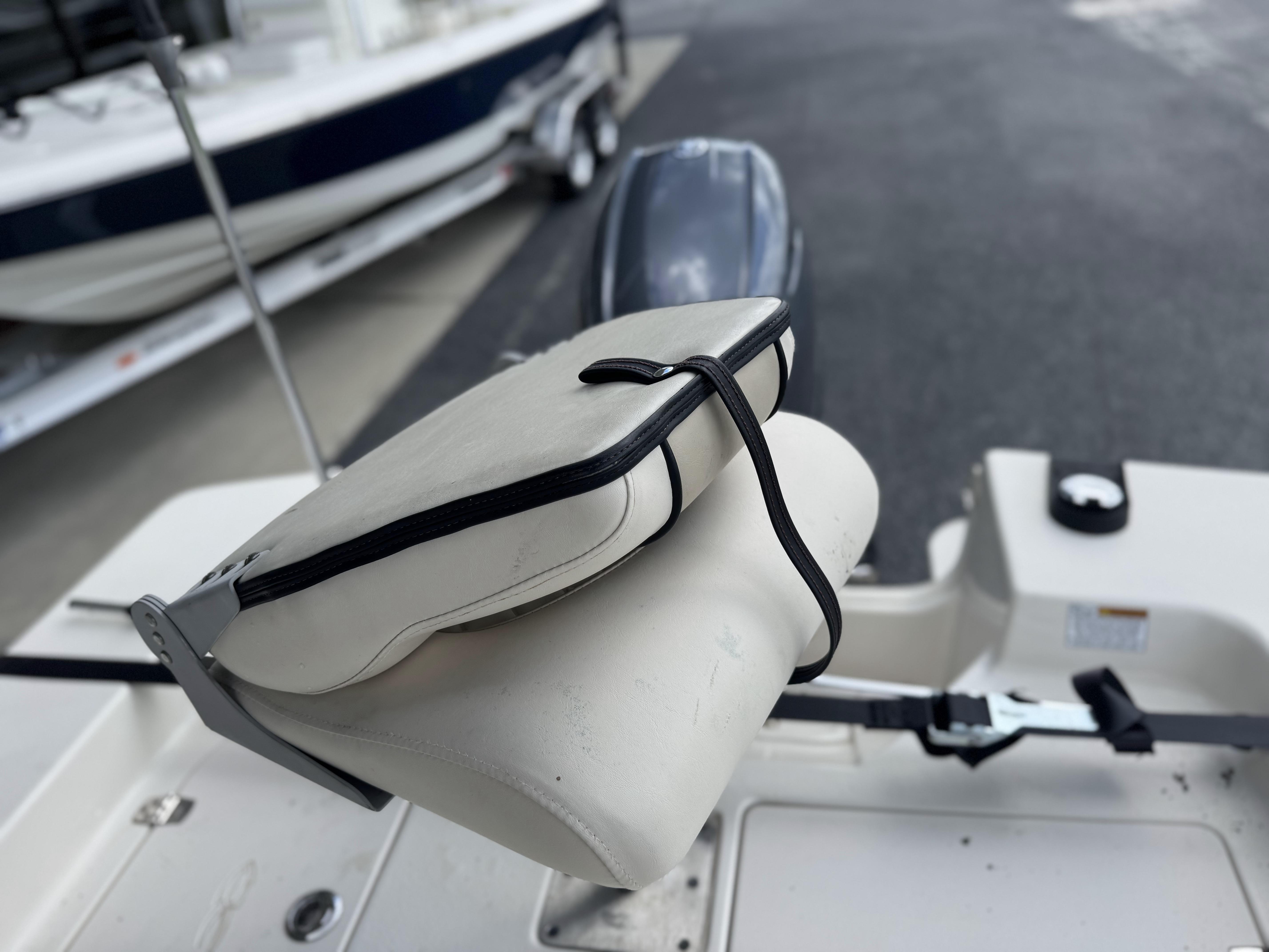 2020 Carolina Skiff 178JLS boat seat with cushion and strap, close-up view.