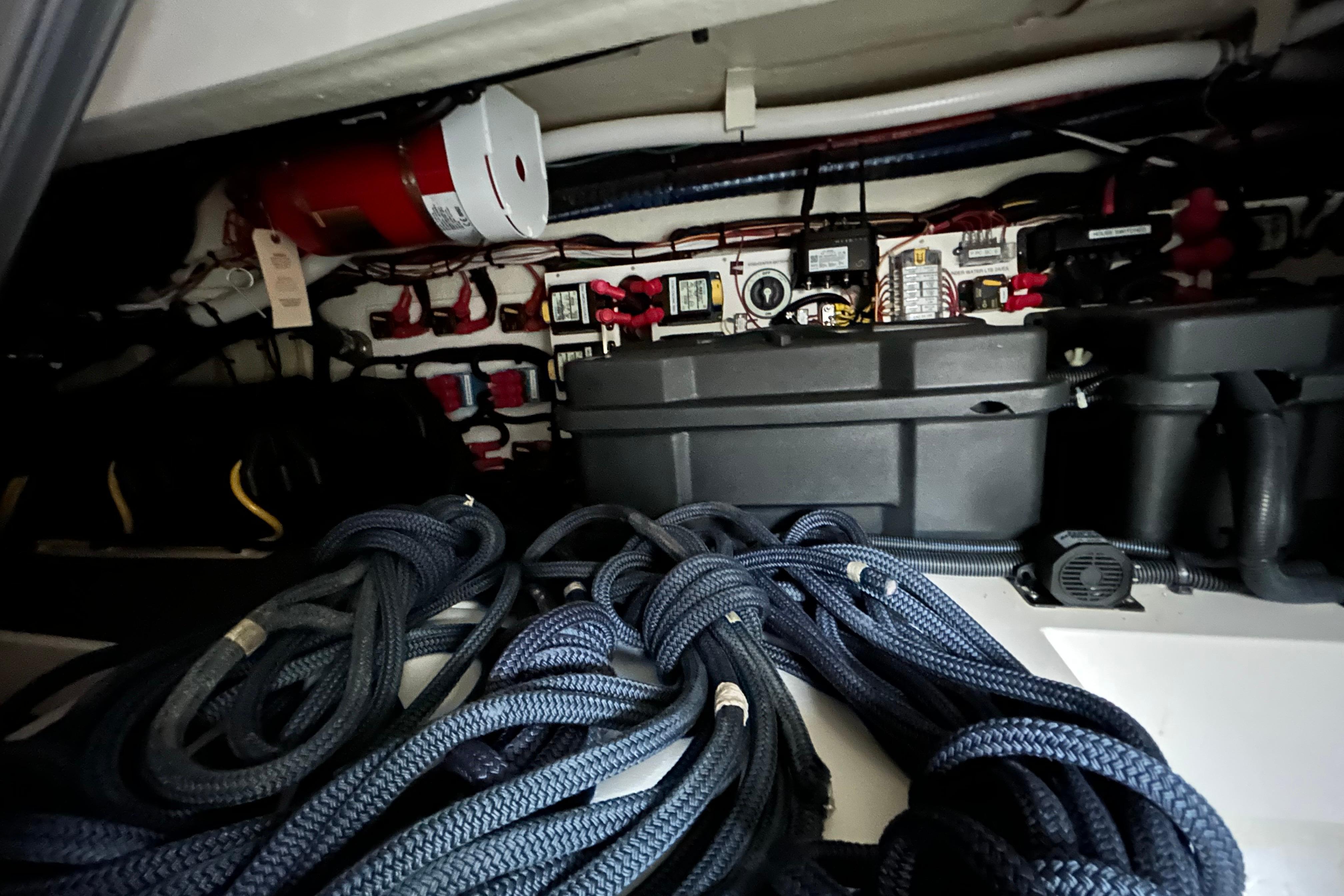 Electrical and mechanical components in cockpit storage u0022basementu0022.